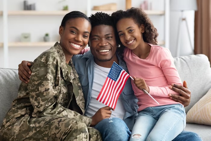 A family holding a flag together